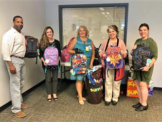 Backpack donation from Charter Communications